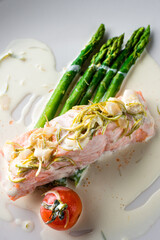 Wall Mural - Grilled salmon with asparagus in bechamel sauce