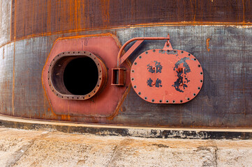 Wall Mural - Opened rusty manhole on the fuel tank shell storage tank. High quality photo