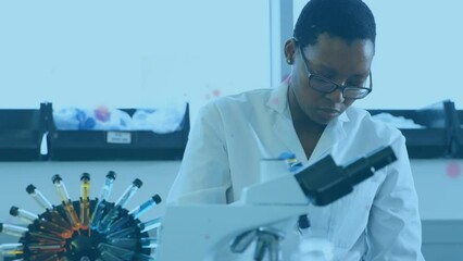 Poster - Animation of light spots over african american female scientist in lab