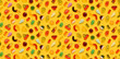 Seamless pattern of assorted gummies jelly gummy fruit sweets candy on yellow background top view flat lay