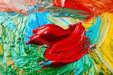 Closeup View Of Artist's Palette With Mixed Bright Paints As Background
