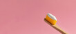 Brush with toothpaste on pink background, space for text. Banner design