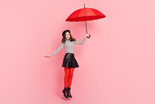 Photo Of Stylish Trendy Lady Fly Jump Hold Parasol Wait Fashion Week Bargain Wear Tights Isolated Pink Color Background