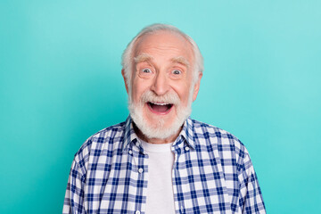 Poster - Portrait of cheerful overjoyed grandpa see sale coupon advertisement wear checkered shirt isolated on teal color background