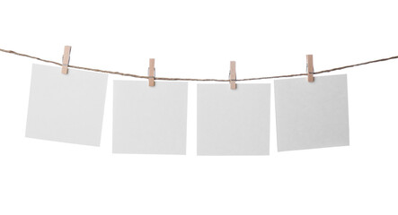 Poster - Clothespins with empty notepapers on string against white background. Space for text