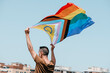 canvas print picture - waves a progress pride flag in the air
