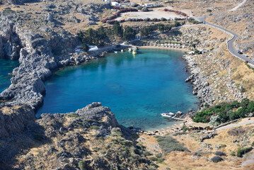  Famous St. Paul's Bay near Lindos city, Rhodes, Greece. Beautiful, blue Mediterranean Sea.