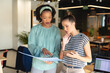 © Wavebreak Media - Multiracial female colleagues discussing over file in creative office