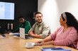 © Wavebreak Media - Multiracial businessman and businesswoman discussing during meeting in creative office