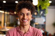 © Wavebreak Media - Portrait of smiling biracial young businessman in creative office