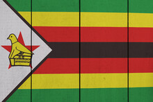 Patriotic Wooden Plank Background In Colors Of Flag. Zimbabwe