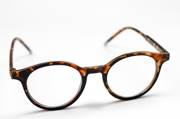 Sticker - Stylish leopard-colored eyeglasses on a white background