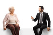 © Ljupco Smokovski - Businessman talking to an elderly lady and sitting on a panel