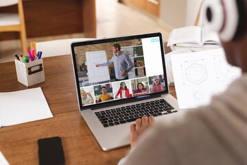 Poster - African american student studying online through video call over laptop at home