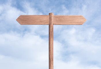 blank signpost with two planks on opposite way and sky background. mock up, template