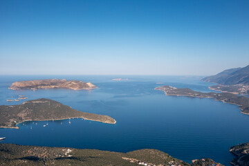 Wall Mural - Aerial view of touristic Kaş town and Meis (Kastellorizo) island with its green nature and deep blue sea. Antalya - Turkey