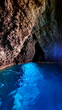 Interior view of sea cave Blue Grotto (Grotta Azzurra) near Isola Bella in Taormina, Sicily, Italy, Europe, EU. Clear magical blue turquoise water surface Ionian Mediterranean sea