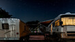 Rv camper camping under starry sky