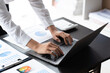 © PaeGAG - Close up hands of young contemporary office manager over laptop keypad during work, businessman using laptop.concept.