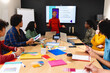 © Wavebreak Media - African american businesswoman discussing ideas with app developers in meeting at office