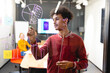 © Wavebreak Media - Young biracial male app developer drawing chart on glass in board room
