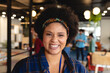 © Wavebreak Media - Portrait of smiling biracial female design professional in creative office