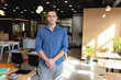 © Wavebreak Media - Portrait of young caucasian creative businessman standing in office
