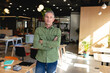 © Wavebreak Media - Portrait of confident mature caucasian creative businessman standing with arms crossed in office