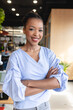 © Wavebreak Media - Portrait of confident mid adult african american creative businesswoman with arms crossed in office
