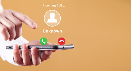 man showing mobile phone with incoming call from unknown caller.