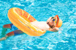 © Volodymyr - Kid boy in swimming pool on inflatable ring. Children swim with orange float. Water toy, healthy outdoor sport activity for children. Kids beach fun. Child splashing in summer water pool.
