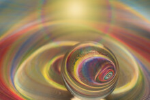 Reflection Of Geometric And Abstract Pattern In Glass Sphere With Rainbow Colors Effect.
