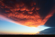 Mammatus Clouds Illuminated By Sunset Light Over A Field In Lubbock, Texas.