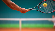 Cropped Hand Holding Tennis Racquet