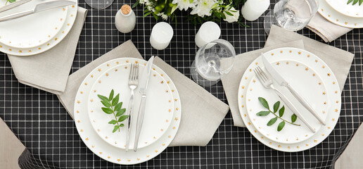 Beautiful festive table setting with floral decor and candles