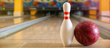 Ball and pin on floor in bowling club