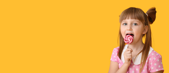 Wall Mural - Cute little girl with lollipop on orange background with space for text