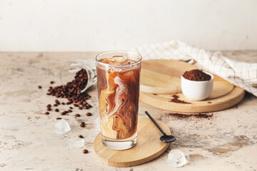 Wall Mural - Wooden board with glass of delicious cold brew coffee and milk on grunge table