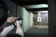 Woman Pistol bullseye target training in a shooting club