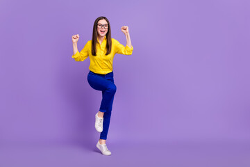 Poster - Full length body size view of attractive cheery girl dancing having fun isolated over bright violet purple color background