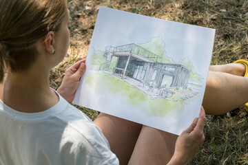 Wall Mural - Contemporay house design hand drawn  sketch in architecht's hands.