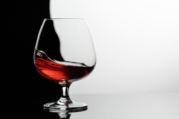 Sticker - Splash of brandy in a snifter glass.