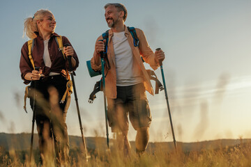 Smiling middle age couple hiking together