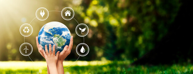 hands raised to earth. environment protection