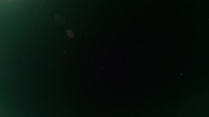 Wall Mural - Universe background. Stardust galaxy. Night view. Deep black sky with shiny small glowing star drops timelapse aerial shooting lense flare blur.