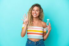 Young Blonde Woman With A Bottle Of Water Isolated On Blue Background Happy And Counting Four With Fingers