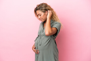 Wall Mural - Girl with curly hair isolated on pink background pregnant and in lateral position