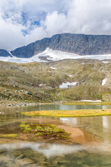 Sticker - Mountain lake in a high altitude landscape