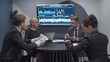 © Synthex - Business people analyzing stock rates while sitting in office, finance discussion