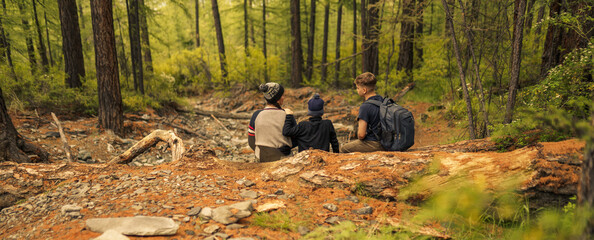 Canvas Print - mother and children hiking in the forest